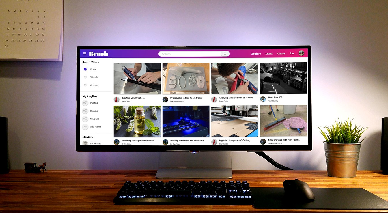 Brush desktop app — Explore page on a monitor in a studio workspace